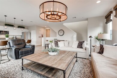 Living area featuring a chandelier, recessed light