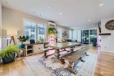 The open floor plan seamlessly connects the dining room to the living room and the kitchen. This space can accommodate large or small gatherings.