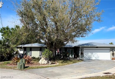 Ranch-style house with concrete driveway, an attac