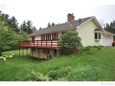 Exterior Back. Great deck for relaxing on!  Slidin