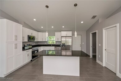 Kitchen with appliances with stainless steel finis