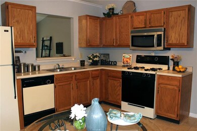 The kitchen offers great cabinet space, neutral counter tops, gas range and all kitchen appliances stay.