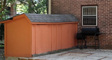 Smaller out building used for storage.