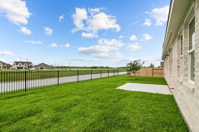 Back patio overlooks the community pond