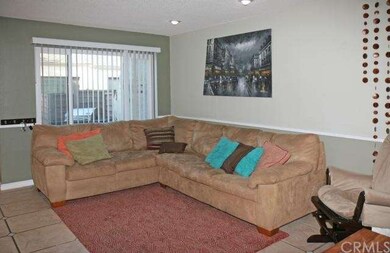 Living Room with Dual Pane Window & View of Patio