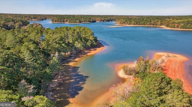 Aerial of narrow long cove behind property