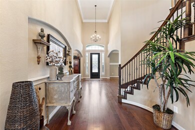 Gorgeous entrance with soaring ceilings.  Formal Dining and Living (Flex Room) to each side.