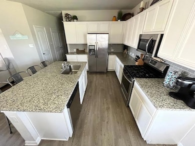 Kitchen featuring appliances with stainless steel