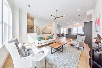 Similar living area with tall ceilings and open, c