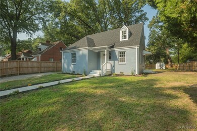 View of front of property featuring a storage shed