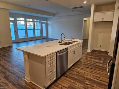 KITCHEN ISLAND LOOKING INTO GREAT ROOM