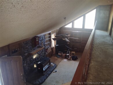 Looking down from upper level into living room.