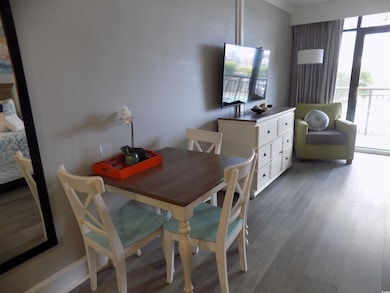 Dining space with wood finished floors