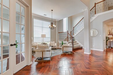 Step inside the foyer to be greeted by engineered hardwood floors, and soaring 2-story ceilings. This home also offers zoned A/C and heating, and a pre-wired alarm system for added peace of mind.