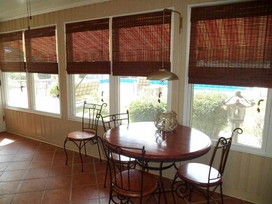 NEWLY TILED FLOORING FINISHES OFF THIS SUNROOM WHI