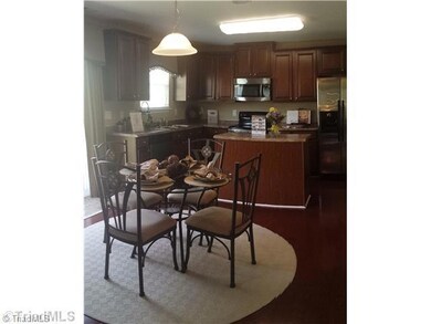 Breakfast. This is a decorated model of the Vivian floor plan and not the actual home. Decorative paint, home decor and furniture is not included in actual home. To demonstrate the floor plan only.