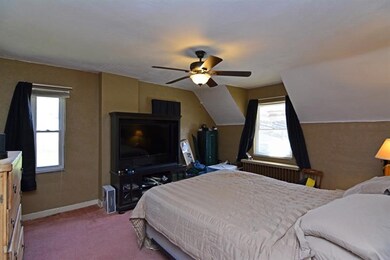 The spacious master bedroom features a lighted cei