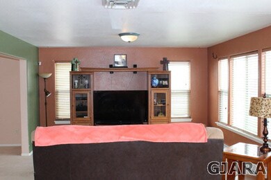 Open to kitchen and breakfast nook.
