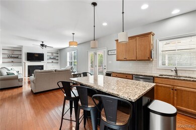 Kitchen with hardwood / wood-style floors, a kitch