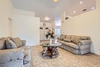 Living room with light tile patterned flooring, vi