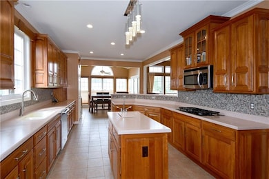 A veggie sink, appliance garage and Corian counter