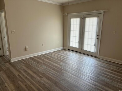 Unfurnished room with dark hardwood / wood-style f