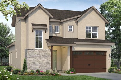 View of front of home with stucco siding, stone s