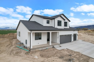 Modern inspired farmhouse featuring a mountain view, a porch, a shingled roof, board and batten siding, and a garage