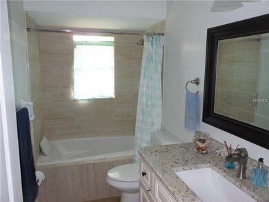 Guest Bathroom features a whirlpool tub and granite counter