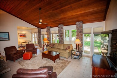 Living room with wood ceiling.