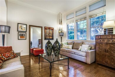 Formal living with high ceilings, archways and har
