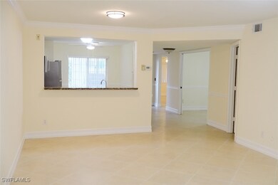 Unfurnished room with baseboards, crown molding, l