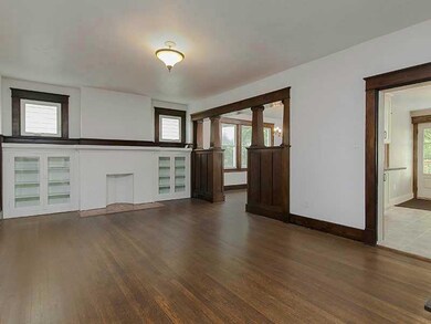 Living Room. Built in bookcase offers space for yo