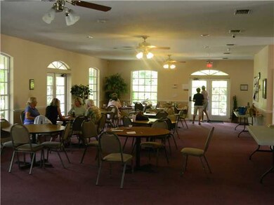 Exterior Front. Collier Club Community Clubhouse