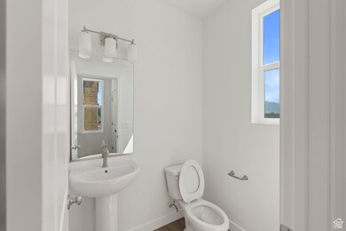 Bathroom featuring toilet and wood finished floors