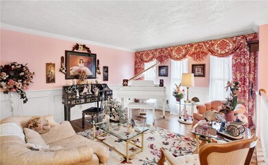 THE SPACIOUS LIVING ROOM IS ELOQUENT WITH CUSTOM D