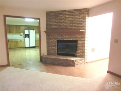 Family room with a gas log fireplace