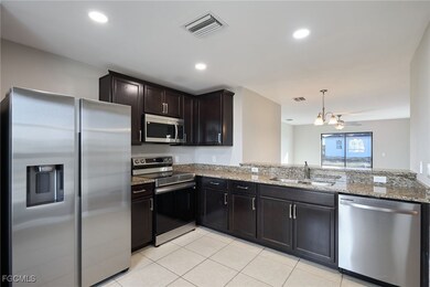 Kitchen with appliances with stainless steel finis