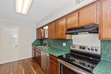 Large pantry and laminate floors round off this gr