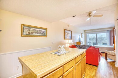 Kitchen with light hardwood / wood-style floors, b