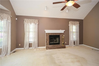 Unfurnished living room with visible vents, carpet
