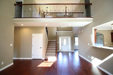 EXAMPLE>>>Beautiful Entry Foyer with Hardwood Flooring, Crown Molding and Look at that Catwalk!!