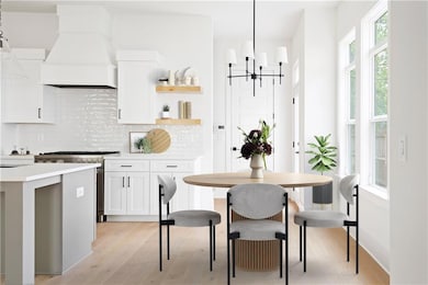 Kitchen with decorative backsplash, premium range 