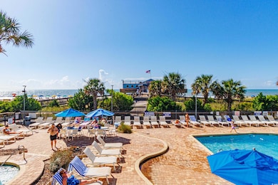View of swimming pool featuring a patio and a water view