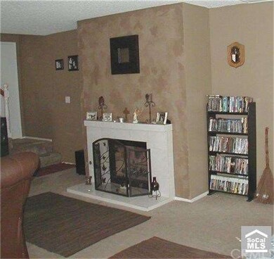 Living Room with Wood & Gas Fireplace