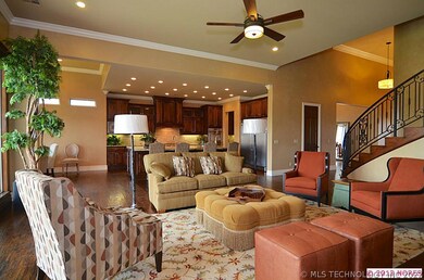 Hardwood floors flow from the entry and open to th