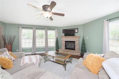 Cozy stone fireplace in the Family Room with views of backyard.