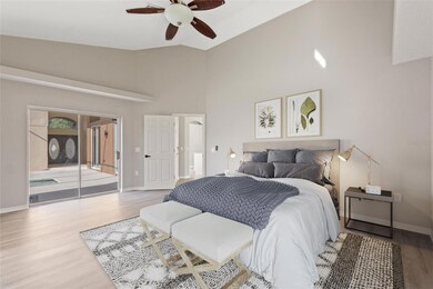 Pool-side virtually staged primary en suite bedroom