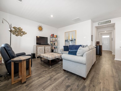Living room featuring dark hardwood / wood-style f