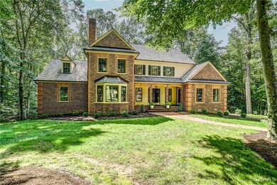 Expansive front lawn and mature trees